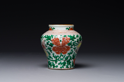 A small Chinese wucai 'Buddhist lion and peony scroll' jar, Transitional period