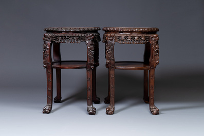 A pair of large Chinese carved wooden stands with marble tops, 19th C.