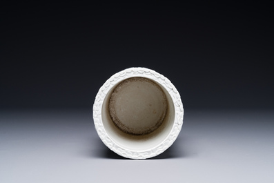 A Chinese monochrome white-glazed biscuit brush pot, signed Wang Bingrong 王炳榮, 19/20th C.