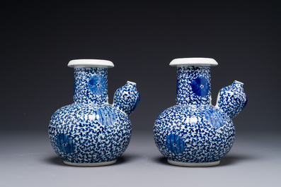 A pair of Chinese blue and white 'lotus scroll' kendis, 19th C.