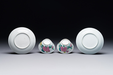 A pair of Chinese famille rose 'peony' cups and saucers, Yongzheng