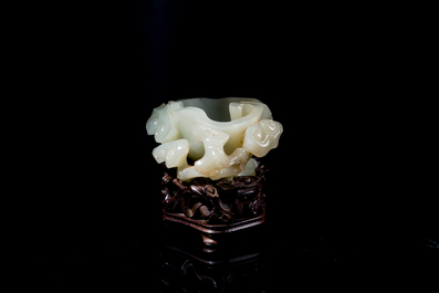 A Chinese celadon jade brush washer on wooden stand, 19/20th C.
