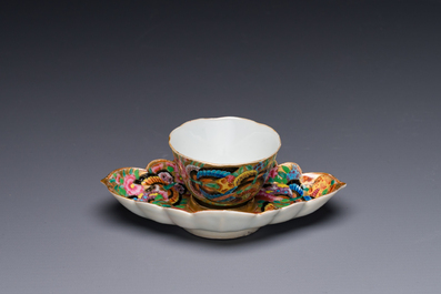 A Chinese Canton famille rose gilt-decorated cup and stand with flowers and butterflies, 19th C.