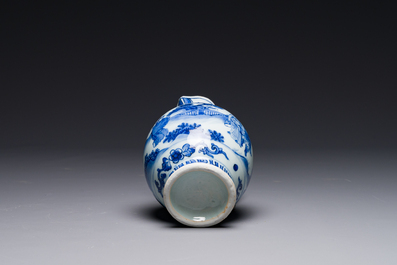 A Chinese blue and white ewer with figures in a landscape, Transitional period