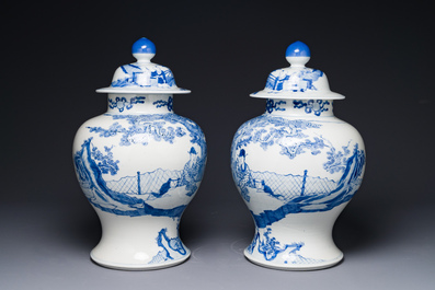 A pair of Chinese blue and white covered vases with figural design, 19th C.