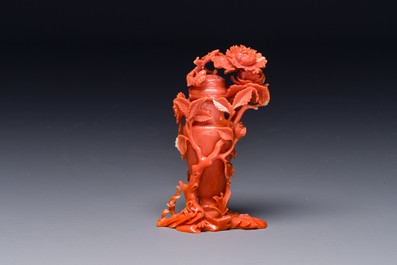 A Chinese red coral sculpture of a vase and cover with peonies, 19/20th C.