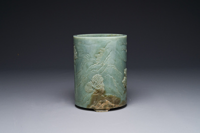 A Chinese spinach jade brush pot with relief design, 18th C.