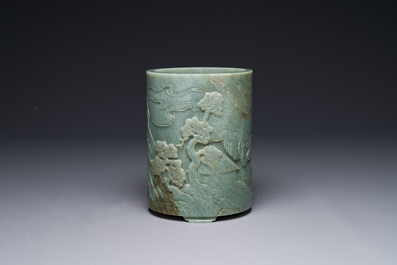 A Chinese spinach jade brush pot with relief design, 18th C.