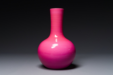 A Chinese monochrome ruby-pink-glazed 'tianqiuping' vase on wooden stand, Yongzheng mark, 19/20th C.