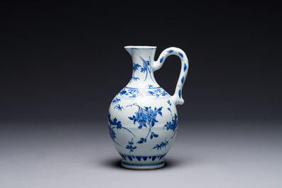 A Chinese blue and white ewer with floral design, Transitional period