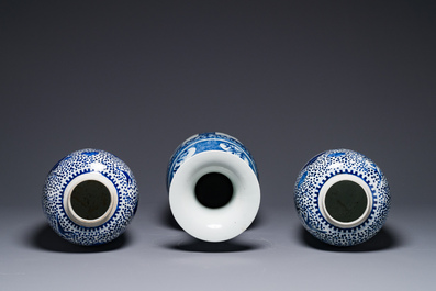 A pair of Chinese blue and white jars and a vase, Kangxi mark, 19th C.