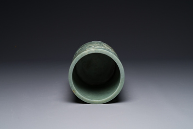 A Chinese spinach jade brush pot with relief design, 18th C.