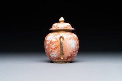 A rare Chinese iron-red-decorated and gilt 'European scene' teapot and cover, Qianlong