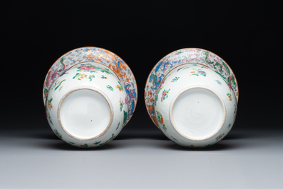 A pair of Chinese Canton famille rose spittoons with dragons, birds, butterflies and flowers, 19th C.