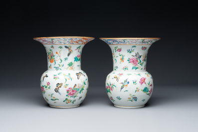 A pair of Chinese Canton famille rose spittoons with dragons, birds, butterflies and flowers, 19th C.