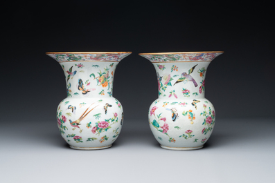 A pair of Chinese Canton famille rose spittoons with dragons, birds, butterflies and flowers, 19th C.