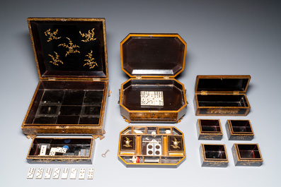 A large Chinese Canton gilt black lacquer tray, thee boxes and a fan, 19th C.