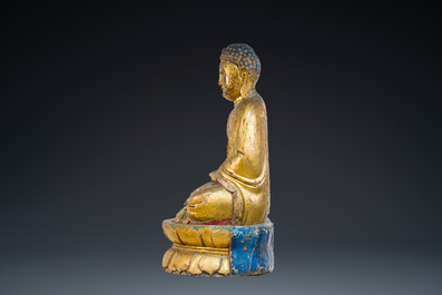 A large Chinese or Vietnamese polychromed and glit wooden Buddha, 19th C.