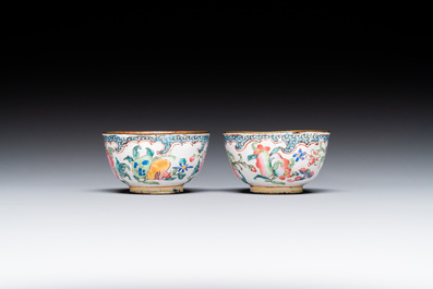 A pair of fine Chinese Canton enamel cups and three saucers with floral design, Yongzheng/Qianlong