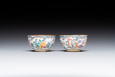 A pair of fine Chinese Canton enamel cups and three saucers with floral design, Yongzheng/Qianlong