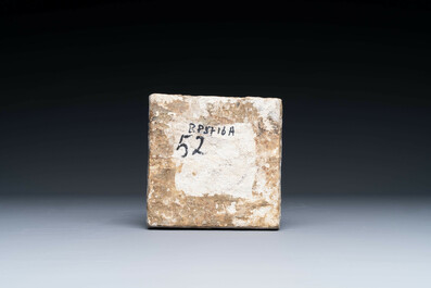 A fine Dutch Delft polychrome maiolica tile with a cherub, ca. 1600