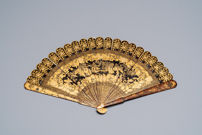 A large Chinese Canton gilt black lacquer tray, thee boxes and a fan, 19th C.