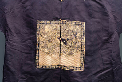 A Chinese dark blue silk overcoat with gold thread embroidered 'rank badges' with wild geese, 19th C.