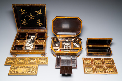 A large Chinese Canton gilt black lacquer tray, thee boxes and a fan, 19th C.