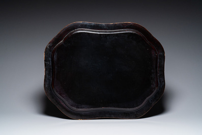 A large Chinese Canton gilt black lacquer tray, thee boxes and a fan, 19th C.