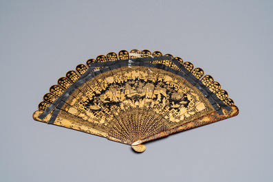 A large Chinese Canton gilt black lacquer tray, thee boxes and a fan, 19th C.