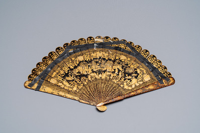 A large Chinese Canton gilt black lacquer tray, thee boxes and a fan, 19th C.