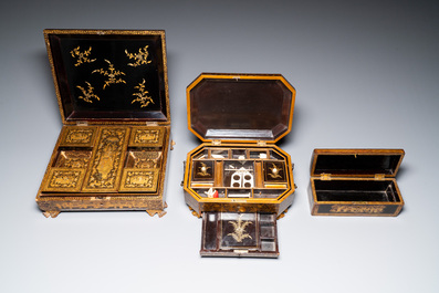 A large Chinese Canton gilt black lacquer tray, thee boxes and a fan, 19th C.