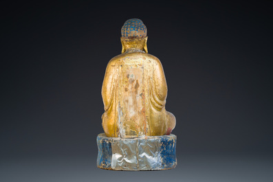 A large Chinese or Vietnamese polychromed and glit wooden Buddha, 19th C.