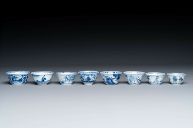 Thirteen Chinese blue and white saucers and twelve cups with figural design, Kangxi/Yongzheng