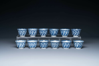 Twelve Chinese blue and white cups and saucers with floral design, jade mark, Kangxi