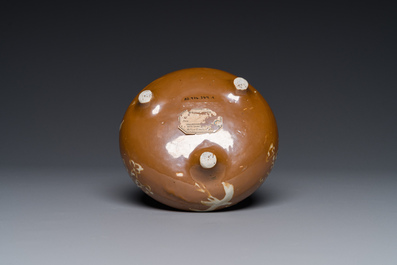 A rare Chinese Swatow slip-decorated brown-glazed tripod censer with cranes, Ming