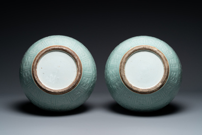 A pair of large Chinese monochrome celadon-glazed anhua 'lotus scroll' bottle vases, 19th C.