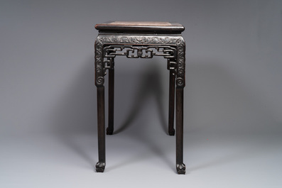 A rectangular Chinese carved wooden console table with a pink marble top, 19th C.