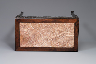 A rectangular Chinese carved wooden console table with a pink marble top, 19th C.