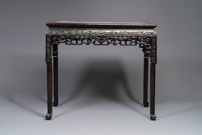 A rectangular Chinese carved wooden console table with a pink marble top, 19th C.