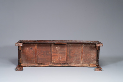 A Chinese carved wooden stand and a low table with marble tops, 19th C.