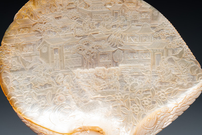 Five Chinese carved mother-of-pearl shells on wooden stands, Canton, 19th C.