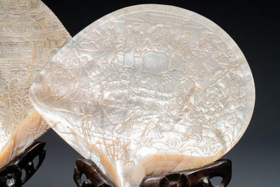 Five Chinese carved mother-of-pearl shells on wooden stands, Canton, 19th C.
