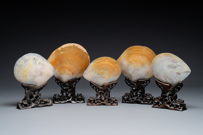 Five Chinese carved mother-of-pearl shells on wooden stands, Canton, 19th C.