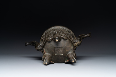 A Chinese bronze 'elephant' tripod censer and cover, Ming