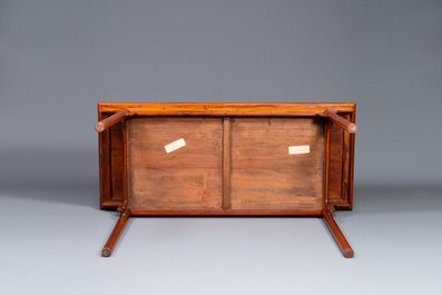 A Chinese huanghuali wooden two-drawer recessed-leg table, 19/20th C.