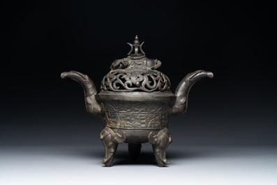 A Chinese bronze 'elephant' tripod censer and cover, Ming