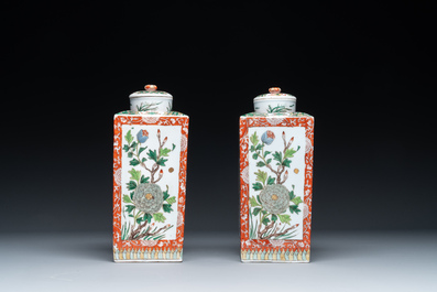 A Chinese blue and white bottle-shaped 'lotus scroll' vase and a pair of square famille verte flasks and covers, 19th C.