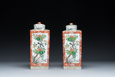 A Chinese blue and white bottle-shaped 'lotus scroll' vase and a pair of square famille verte flasks and covers, 19th C.