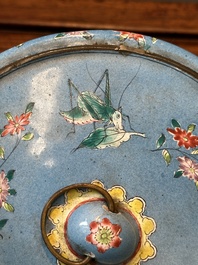 A Chinese Canton enamel circular hand mirror, early 19th C.